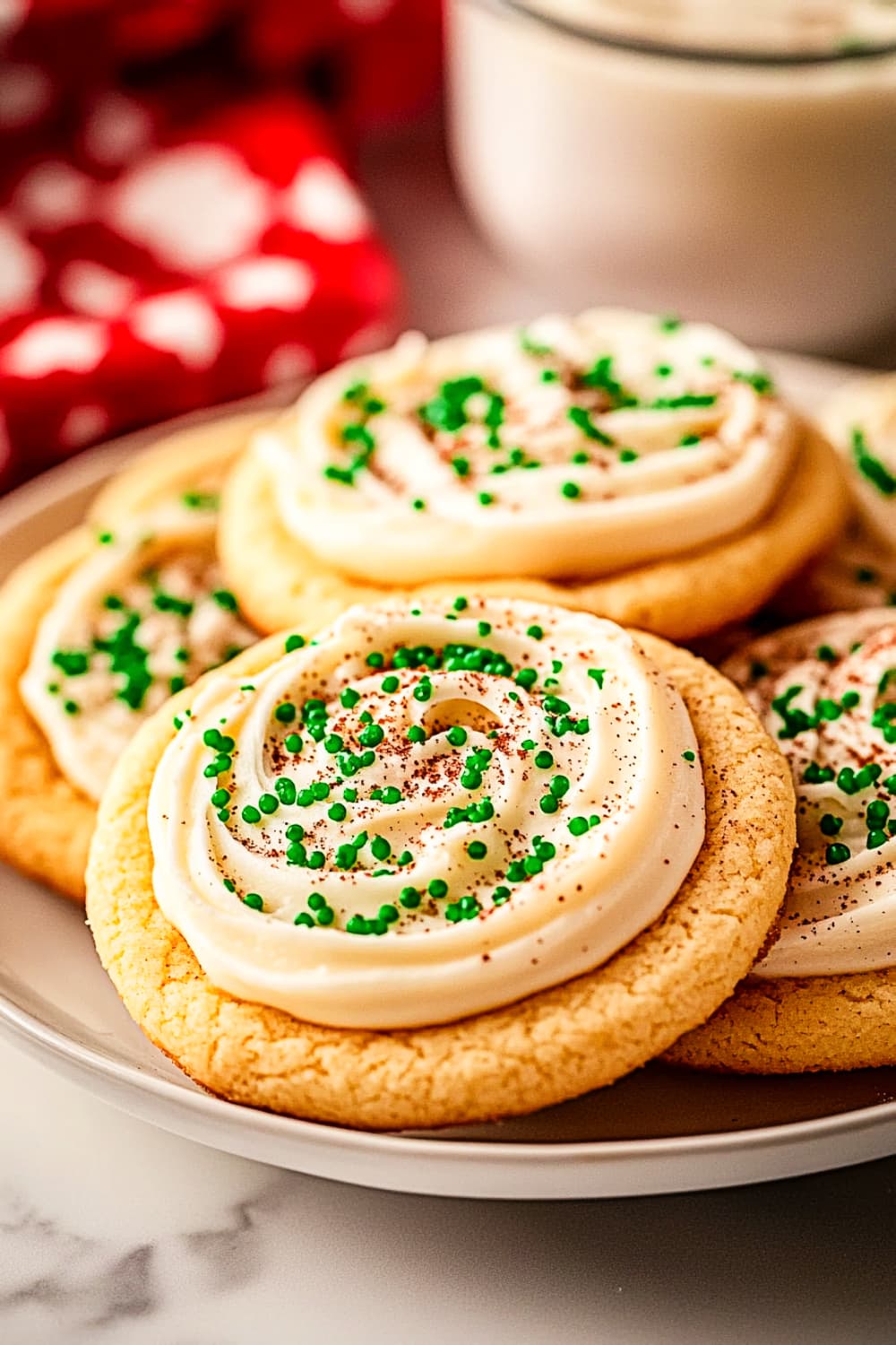 Fluffy thick sugar cookies with green cream cheese frosting