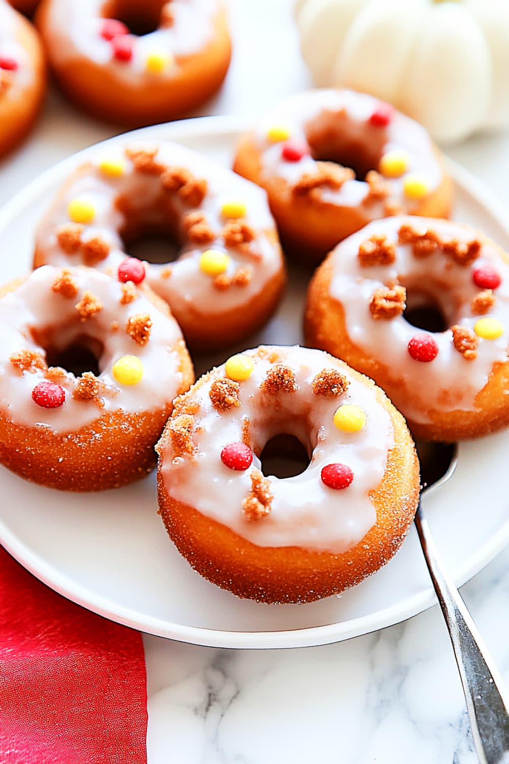 Pumpkin Donuts recipe vanilla glaze with crushed candies