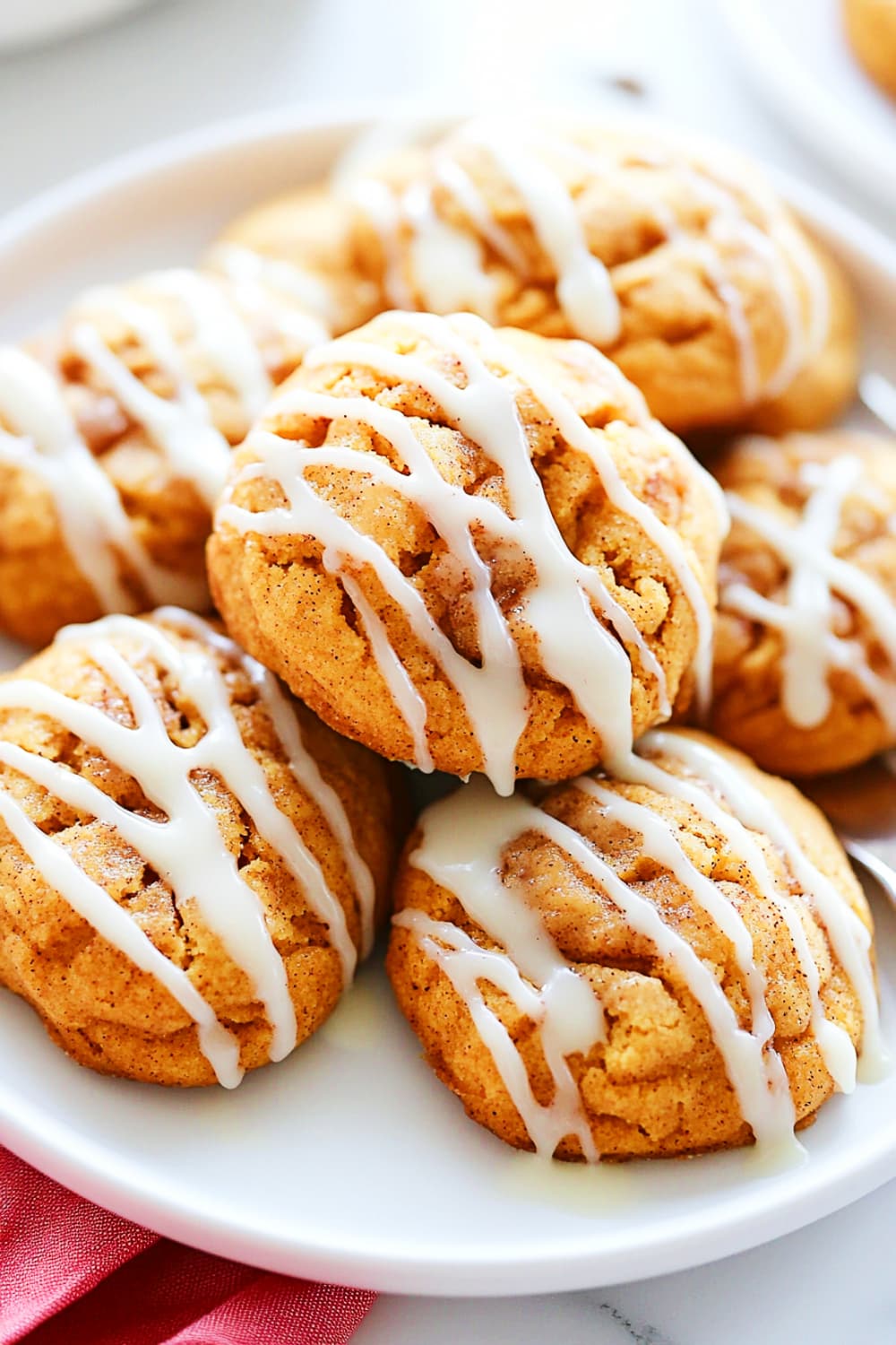 Snickerdoodle pumpkin cookies with cinnamon glaze