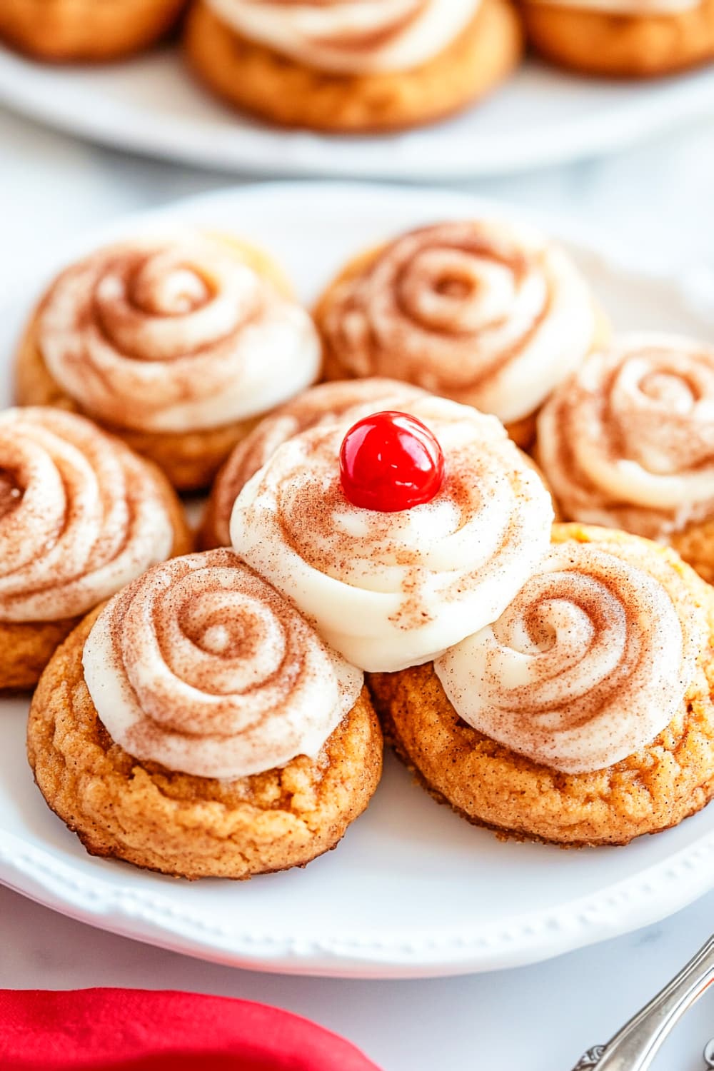 Snickerdoodle pumpkin cookies with cheese cream and cherry