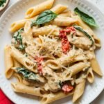 Creamy Marry Me Chicken Pasta recipe featuring tender chicken, sun-dried tomatoes, fresh spinach, and Parmesan cheese in a rich garlic cream sauce. A delicious and easy 30-minute pasta dish perfect for dinner.