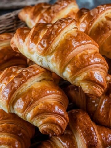 Golden and Flaky Gipfeli Recipe: A basket filled with beautifully baked, golden brown Gipfeli, showcasing their flaky layers and buttery texture, perfect for breakfast or a snack.