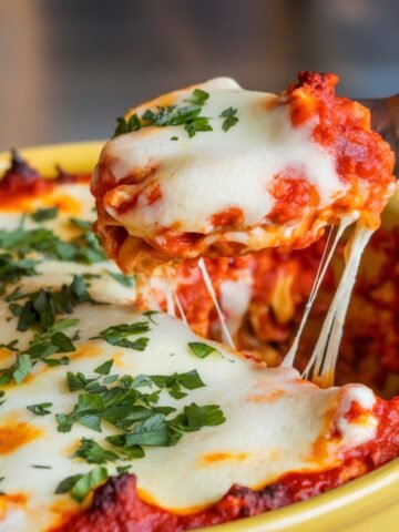 A delicious Grilled Chicken Parmesan Recipe featuring crispy, golden-brown chicken smothered in marinara sauce, topped with melted mozzarella cheese, and garnished with fresh parsley. This cheesy, comforting dish is packed with bold Italian flavors and perfect for a hearty homemade meal.