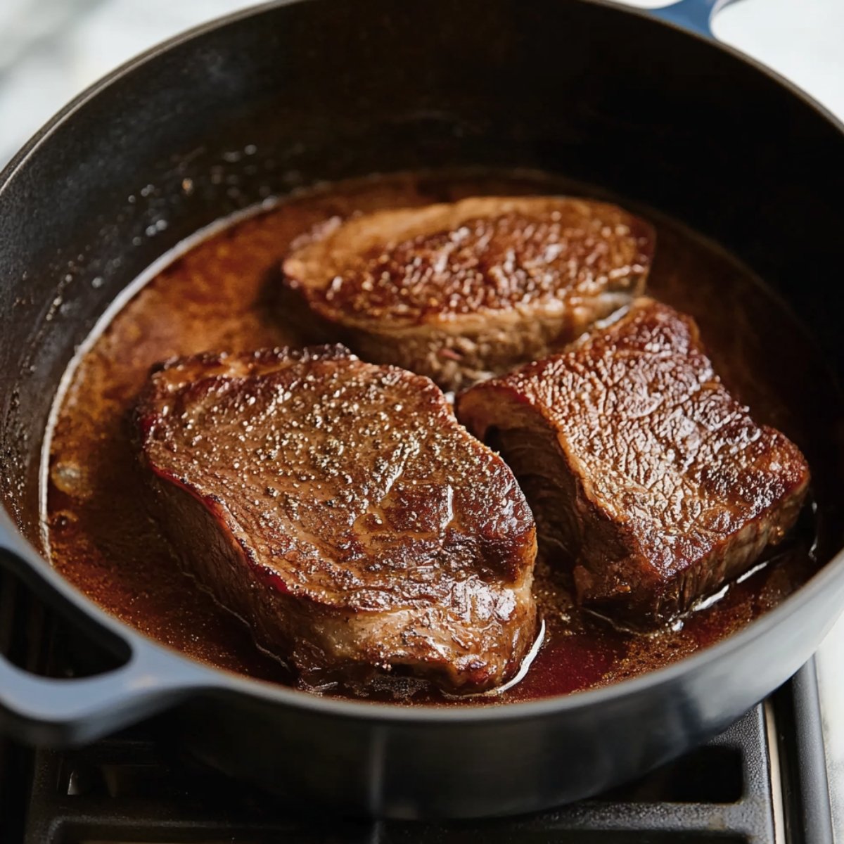 Heat a Dutch oven or heavy pot over medium-high heat. Add oil, then sear meat in the center of the pan for 4 minutes. Turn meat over with tongs; sear for 3 to 4 minutes on each side. Remove meat from the pot.