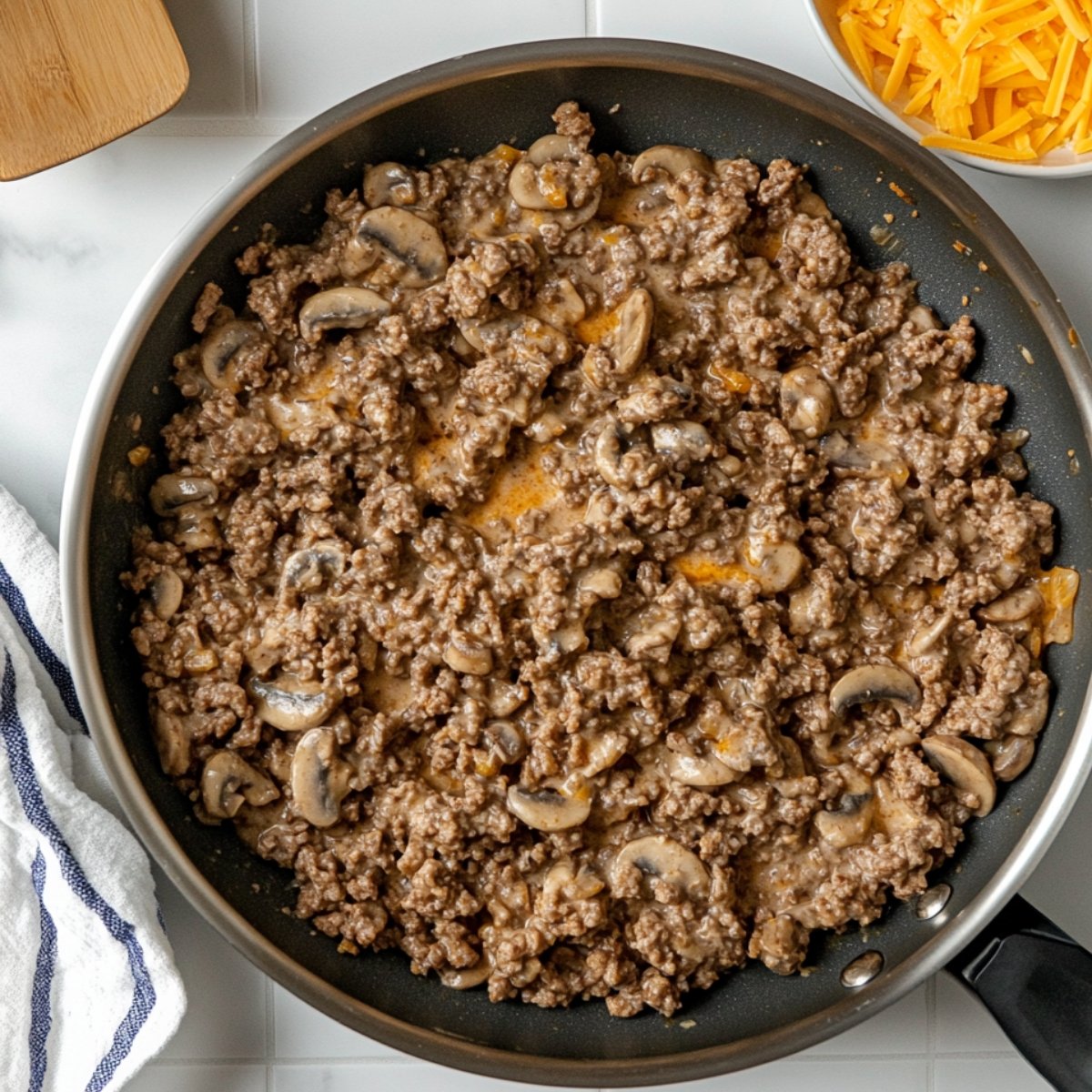 Heat a large skillet over medium-high heat. Cook and stir ground beef in the hot skillet until completely browned and crumbly, 7 to 10 minutes. Stir in condensed soup; season with salt and black pepper.