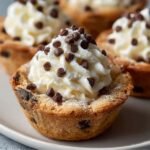 Easy Cannoli Cookie Cups Recipe with creamy ricotta filling topped with mini chocolate chips on a white plate.