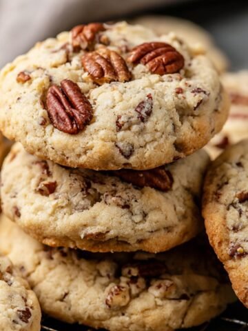 Butter Pecan Cookies with golden edges, toasted pecans on top, and a soft, crumbly texture.
