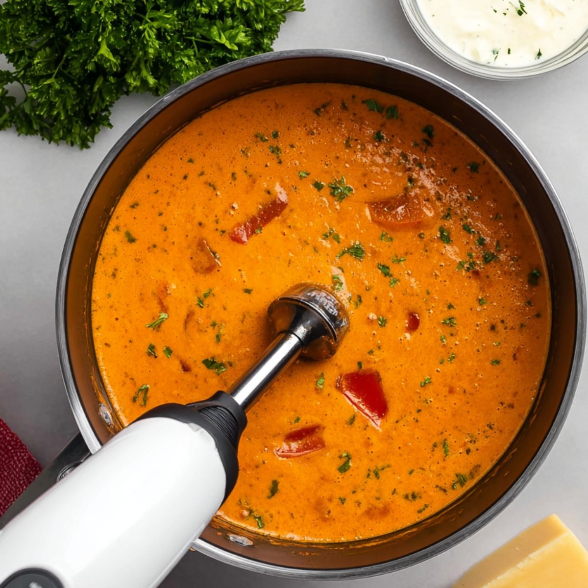 Remove the pot from the heat. Using an immersion blender, blend the soup until completely smooth and creamy with no chunks left. If you don't have an immersion blender, carefully transfer the soup in batches to a regular blender