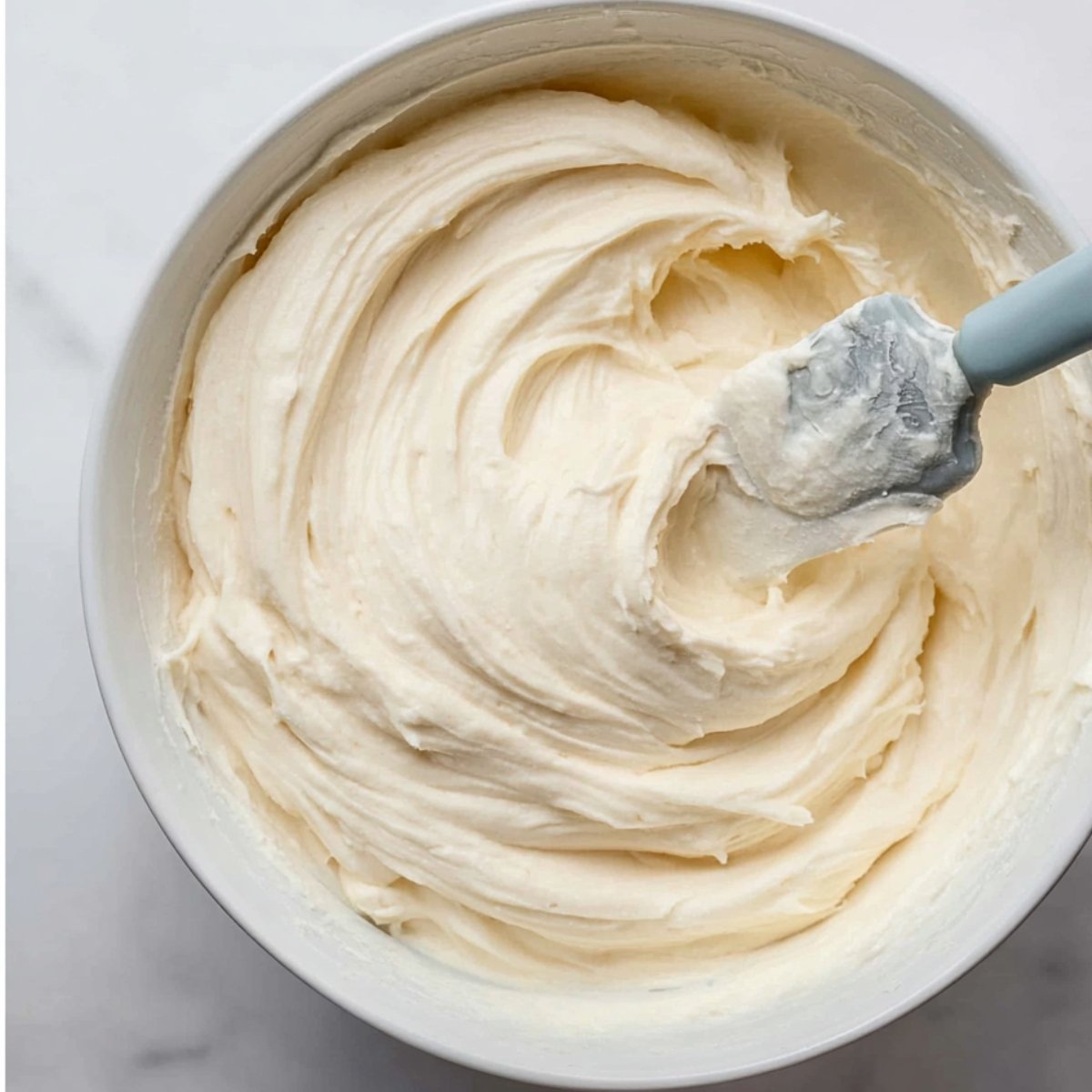 In a large bowl, use a hand mixer or stand mixer with a paddle attachment to beat the softened butter on high speed for 1 minute until it's creamy. Add the confectioners' sugar and beat on medium speed for 1 to 2 minutes. Add the heavy cream and vanilla extract, then beat on high speed for 2 to 3 minutes until the filling is smooth and fluffy. Taste it and add a pinch of salt if needed. If the filling seems too thick, add a tablespoon of room-temperature heavy cream to loosen it up.