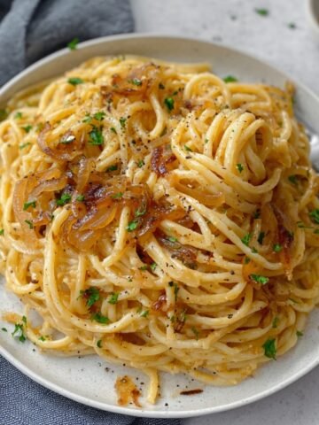 Caramelized Onion Pasta are combined in a pan, creating a flavorful and comforting dish.