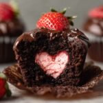 Chocolate Covered Strawberry Cupcakes with a heart-shaped strawberry filling, topped with ganache and a strawberry.