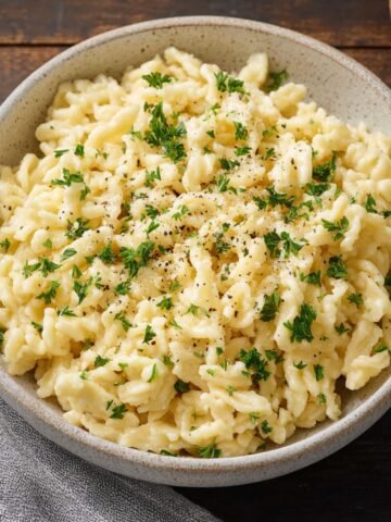 Homemade Spaetzle served in a bowl, showcasing the soft, tender texture of the dumplings.